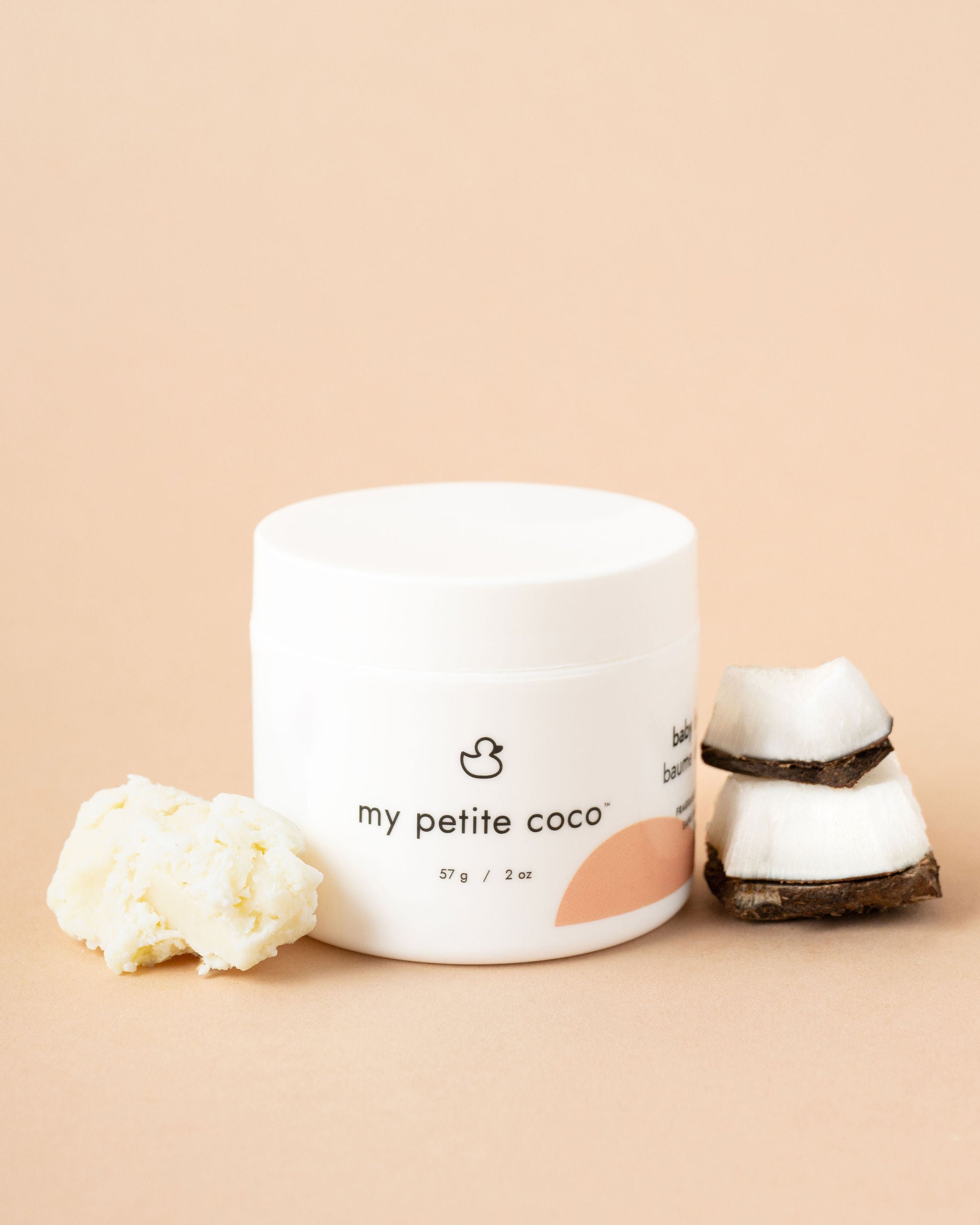 Close-up of My Petite Coco nourishing baby balm with natural ingredients.